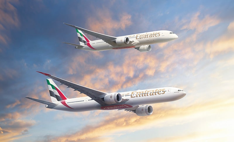 Two Emirates airplanes in the sky